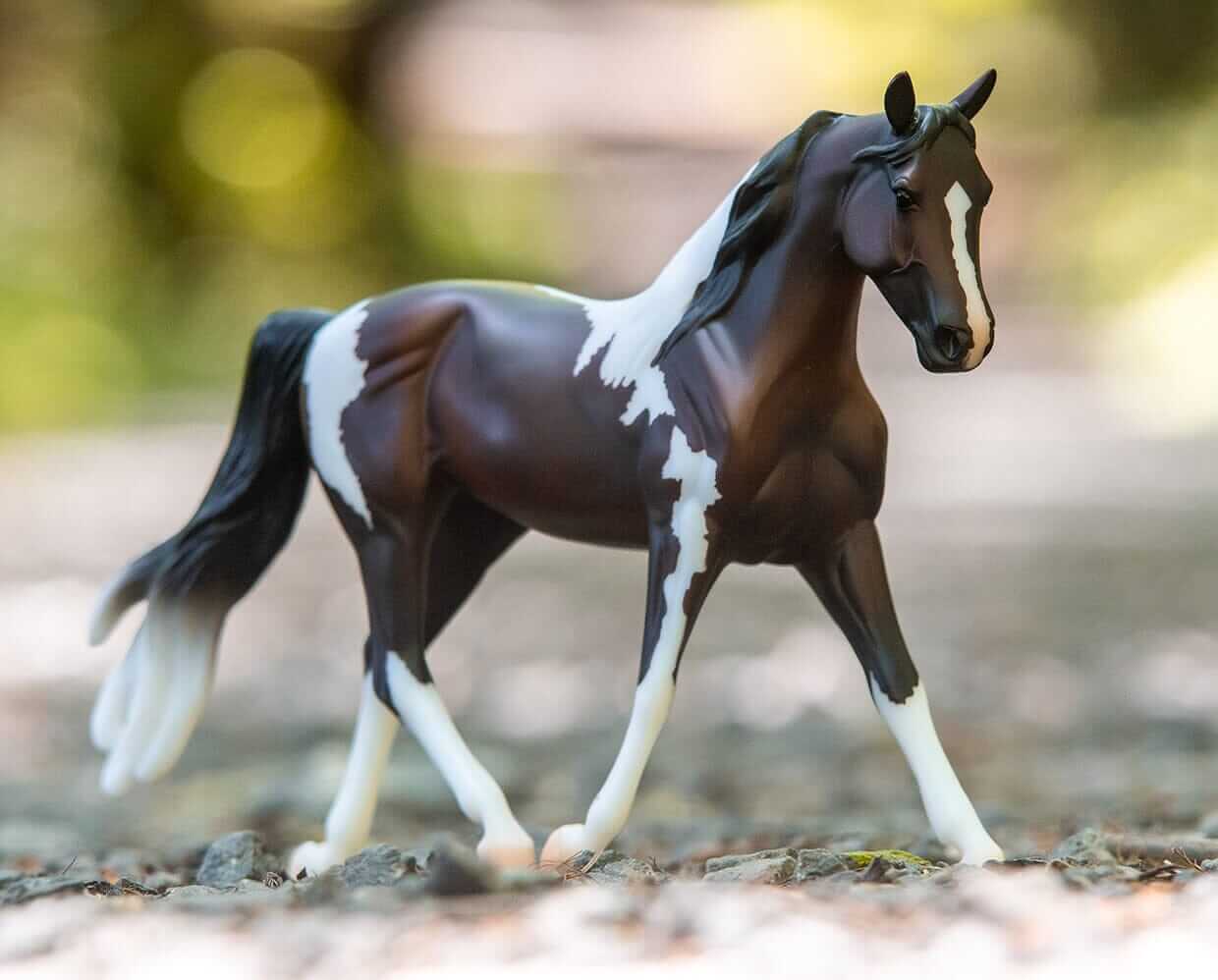 Breyer Pinto model with scenic background